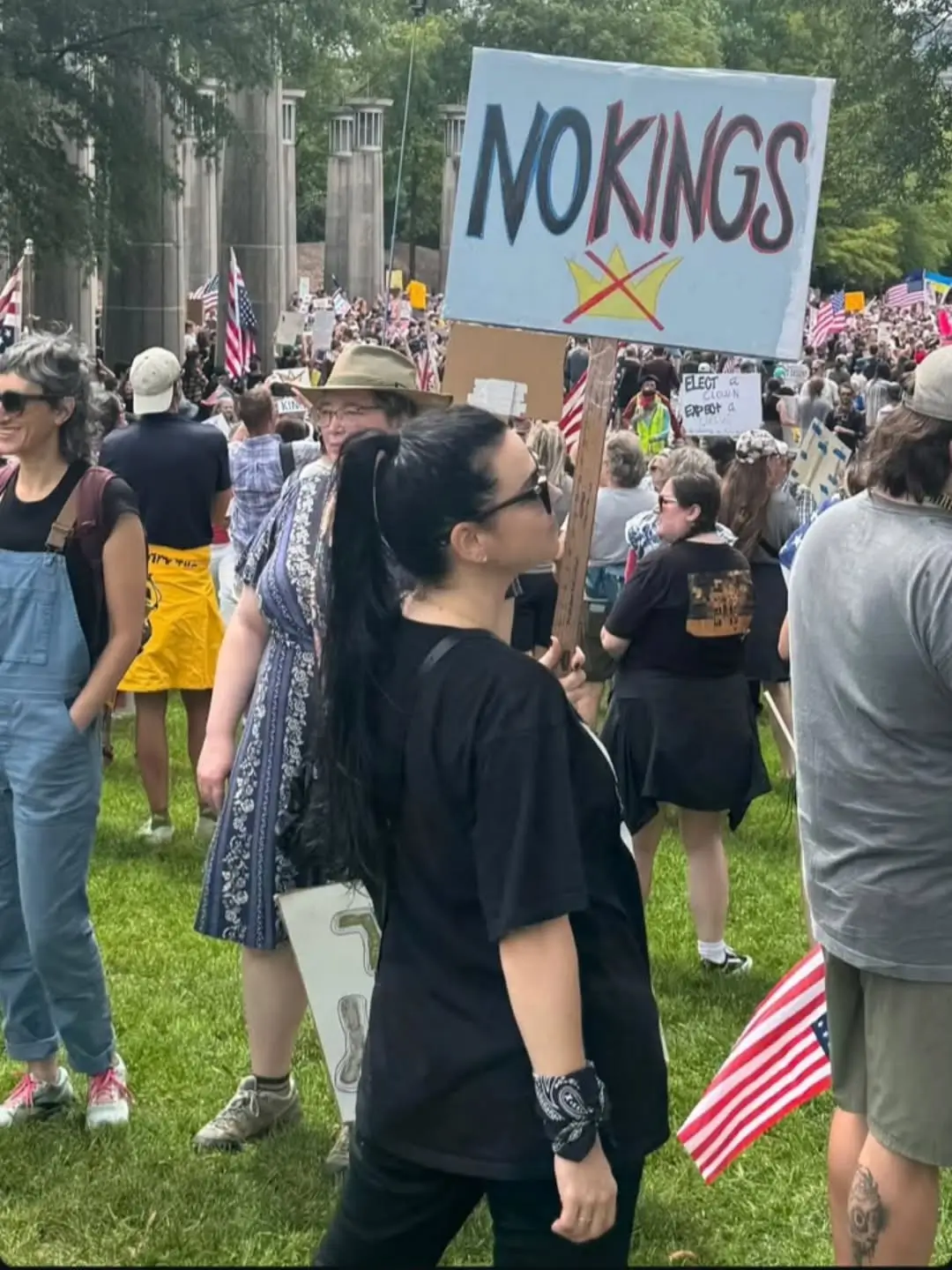Amy Lee holds a protest sign opposing U.S. President Donald Trump.